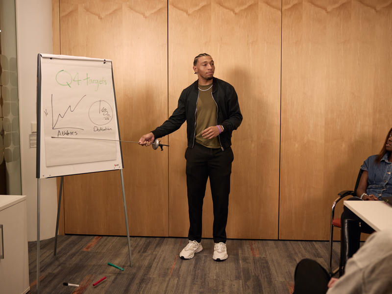 a person standing in front of a whiteboard