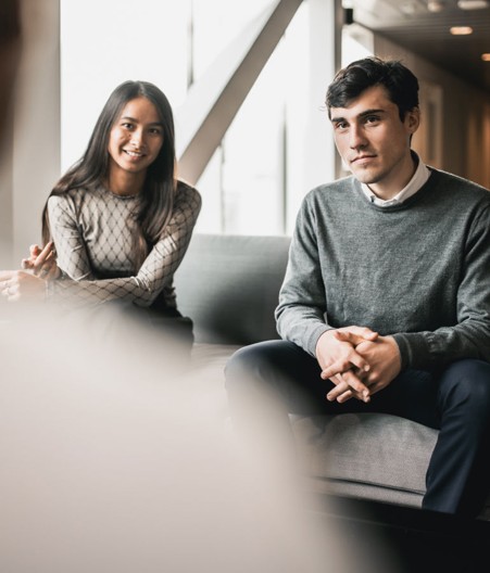 a person and person sitting on a couch
