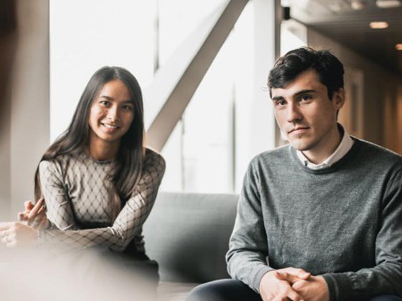 a person and person sitting on a couch